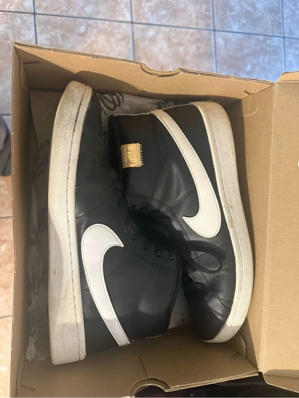 Nike Men’s Black and White High-Top Sneakers with Gold Tongue Tag